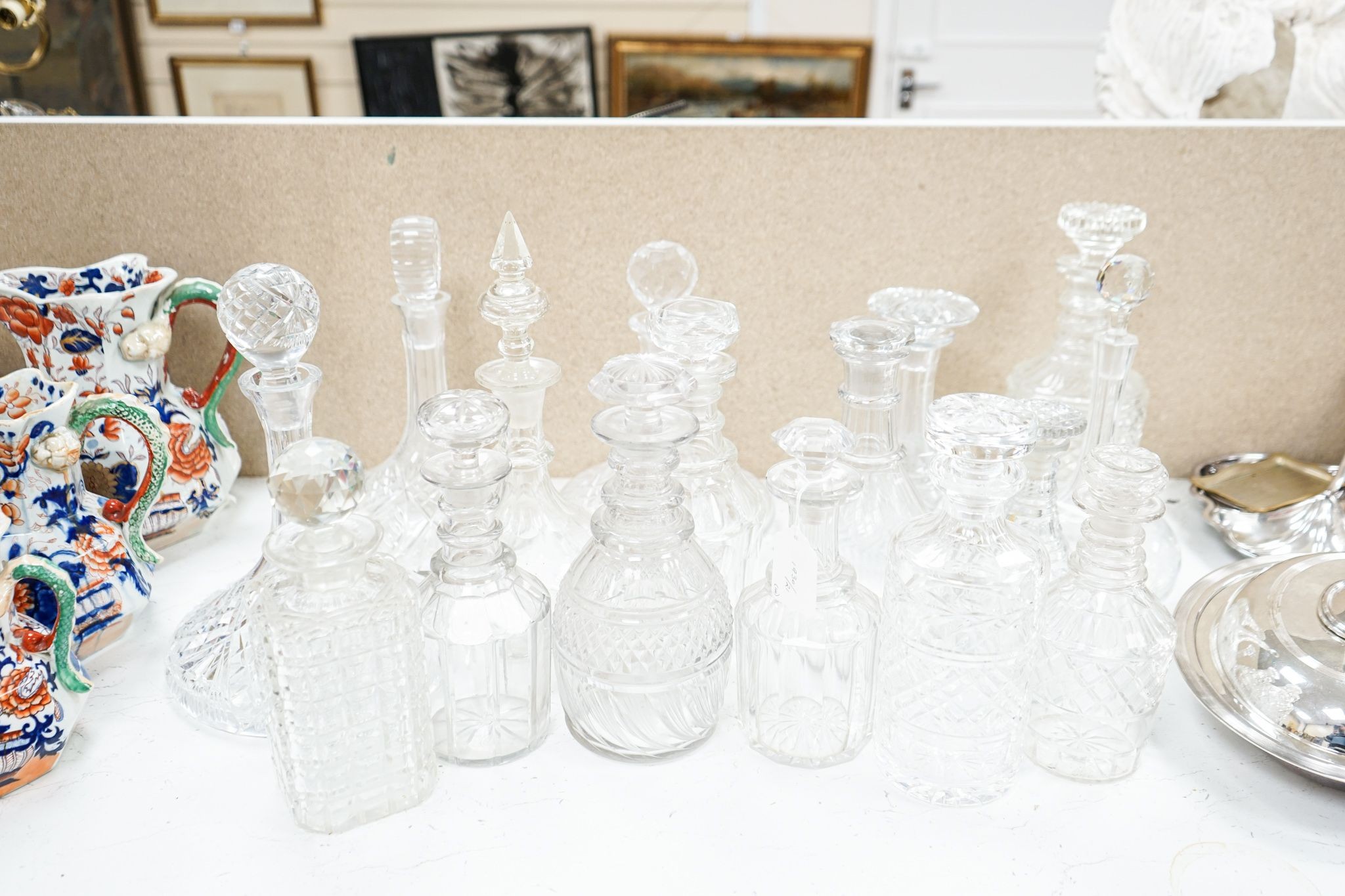 Fourteen various glass decanters 33cm